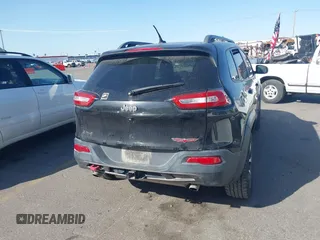 2015 Jeep Cherokee Trailhawk with VIN 1C4PJMBS4FW556822, listed as a IAAI auction lot 42412874 with 129,865 mi miles and . Bid and sale history available at DreamBid. Image 16.