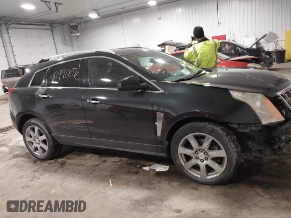 2011 Cadillac SRX Performance Collection with VIN 3GYFNEEY9BS533994, listed as a IAAI auction lot 40990072 with 168,134 mi miles. Bid and sale history available at carsss.com. Image 14.