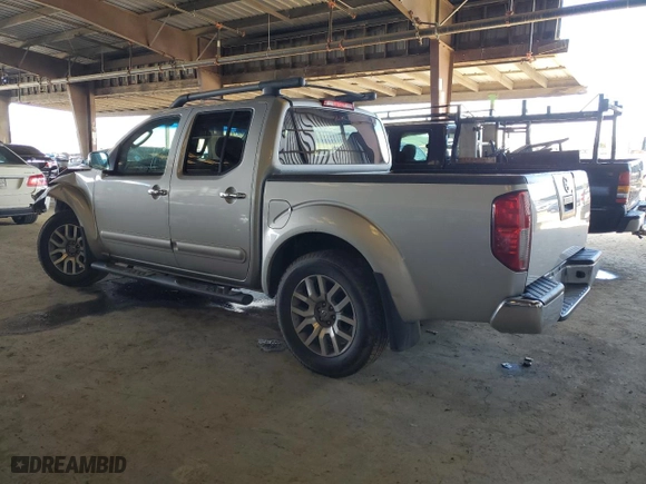 2009 Nissan Frontier SE with VIN 1N6AD07U69C403815, listed as a Copart auction lot 49161015 with 181,843 mi miles and Salvage Title. Bid and sale history available at carsss.com. Image 2.