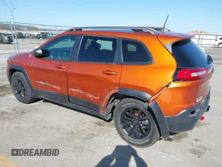 2016 Jeep Cherokee Trailhawk with VIN 1C4PJMBBXGW251682, listed as a IAAI auction lot 41973696 with 100,411 mi miles. Bid and sale history available at carsss.com. Image 3.