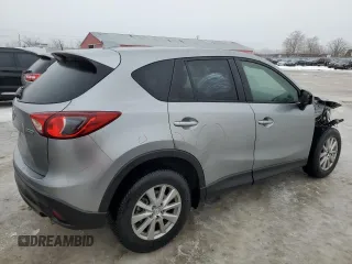 2015 Mazda CX-5 Sport with VIN JM3KE4BEXF0499688, listed as a Copart auction lot 88988095 with 258,460 mi miles and Salvage title. Bid and sale history available at DreamBid. Image 3.