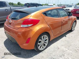 2013 Hyundai Veloster w/Black Int with VIN KMHTC6AD0DU147017, listed as a IAAI auction lot 42707858 with 115,130 mi miles and . Bid and sale history available at DreamBid. Image 4.