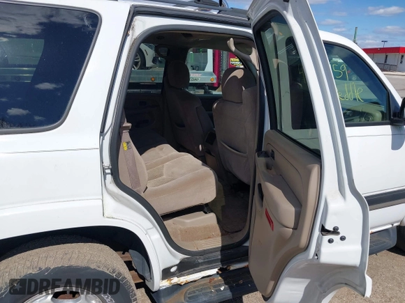 2005 Chevrolet Tahoe LS with VIN 1GNEK13T65J198121, listed as a IAAI auction lot 41826459 with 233,718 mi miles and . Bid and sale history available at DreamBid. Image 8.