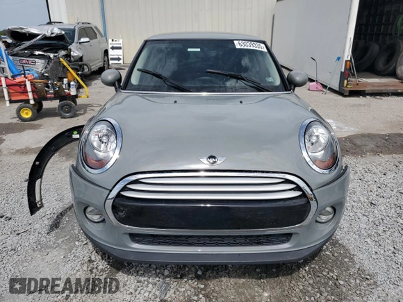 2014 MINI Hardtop with VIN WMWXM5C51ET934047, listed as a Copart auction lot 63039335 with 104,446 mi miles and Salvage title. Bid and sale history available at DreamBid. Image 5.