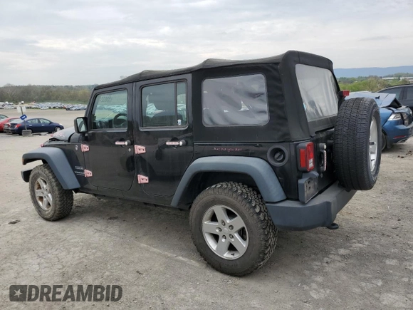 2015 Jeep Wrangler Unlimited Willys Wheeler with VIN 1C4BJWDG3FL601197, listed as a Copart auction lot 53832465 with 216,141 mi miles and Salvage Title. Bid and sale history available at DreamBid. Image 2.