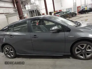 2020 Toyota Prius L Eco with VIN JTDKARFU1L3117299, listed as a IAAI auction lot 42544586 with 42,560 mi miles and . Bid and sale history available at DreamBid. Image 13.