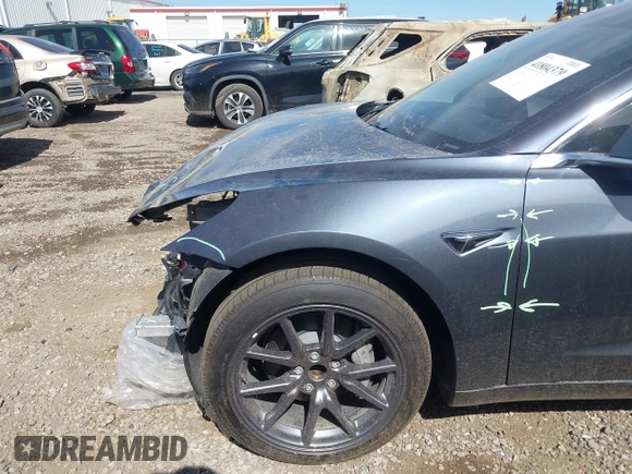 2019 Tesla Model 3 Mid Range with VIN 5YJ3E1EA5KF327679, listed as a IAAI auction lot 41804379 with 87,208 mi miles and . Bid and sale history available at DreamBid. Image 19.