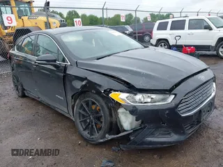 2014 Ford Fusion SE Hybrid with VIN 3FA6P0LU9ER310990, listed as a IAAI auction lot 42336303 with 197,588 mi miles and . Bid and sale history available at DreamBid. Image 1.