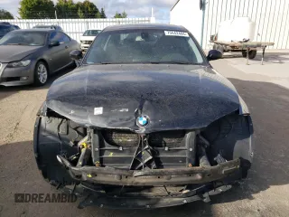 2009 BMW 1 Series 128i with VIN WBAUP73529VK75976, listed as a Copart auction lot 75642404 with 131,653 mi miles and Salvage Title. Bid and sale history available at carsss.com. Image 5.