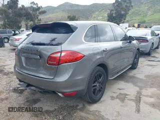 2012 Porsche Cayenne S Hybrid with VIN WP1AE2A25CLA90636, listed as a IAAI auction lot 41922089 with 90,318 mi miles and . Bid and sale history available at DreamBid. Image 4.