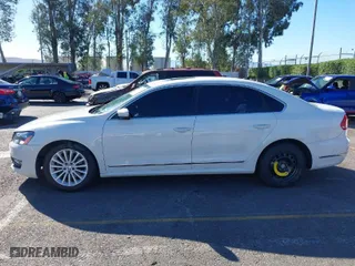2015 Volkswagen Passat 1.8T SE w/Sunroof & Nav with VIN 1VWBT7A3XFC075648, listed as a IAAI auction lot 40808040 with 189,620 mi miles. Bid and sale history available at carsss.com. Image 14.