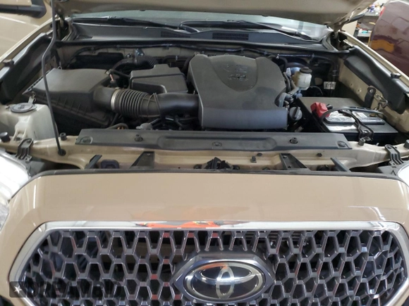 2019 Toyota Tacoma SR z VIN 3TMCZ5AN1KM285074, wystawiony jako Copart lot #53545975 z przebiegiem 53 838 mil mil oraz Szkoda całkowita • Salvage title. Historia ofert i sprzedaży dostępna na DreamBid. Obrazek 11.