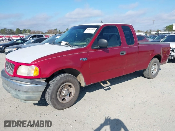 2000 Ford F-150 XL with VIN 1FTZX1729YNC32076, listed as a IAAI auction lot 41523364 with 216,726 mi miles. Bid and sale history available at carsss.com. Image 17.