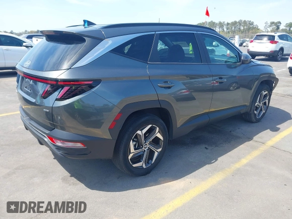2022 Hyundai Tucson SEL z VIN 5NMJCCAE4NH096813, wystawiony jako IAAI lot #41899641 z przebiegiem 23 668 mil mil oraz . Historia ofert i sprzedaży dostępna na DreamBid. Obrazek 4.