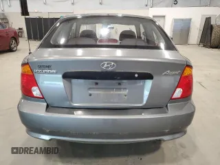 2004 Hyundai Accent z VIN KMHCF35C14U310393, wystawiony jako Copart lot #57840235 z przebiegiem 50 825 mil mil oraz Tytuł czysty. Historia ofert i sprzedaży dostępna na DreamBid. Obrazek 6.