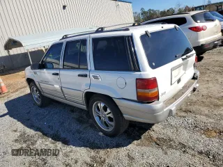 1996 Jeep Grand Cherokee Laredo with VIN 1J4FX58SXTC349575, listed as a Copart auction lot 80545584 with 302,636 mi miles and Salvage Title. Bid and sale history available at carsss.com. Image 2.