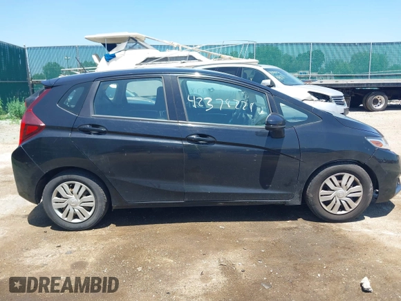 2015 Honda Fit LX z VIN 3HGGK5H56FM712266, wystawiony jako IAAI lot #42378228 z przebiegiem 140 423 mil mil oraz . Historia ofert i sprzedaży dostępna na DreamBid. Obrazek 13.