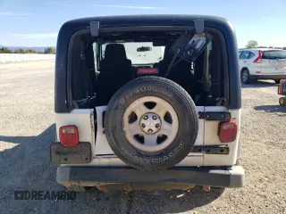 2006 Jeep Wrangler Sport Right Hand Drive with VIN 1J4F449S76P747454, listed as a Copart auction lot 77819214 with 184,763 mi miles and Salvage Title. Bid and sale history available at carsss.com. Image 10.