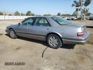 1997 Cadillac Seville Luxury SLS with VIN 1G6KS52Y0VU801906, listed as a Copart auction lot 65169364 with 191,627 mi miles and Salvage Title. Bid and sale history available at carsss.com. Image 2.