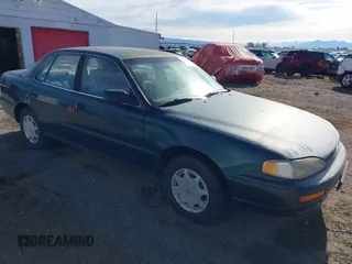 1996 Toyota Camry DX z VIN 4T1BG12K7TU661879, wystawiony jako IAAI lot #42203349 z przebiegiem 213 970 mil mil oraz . Historia ofert i sprzedaży dostępna na DreamBid. Obrazek 1.