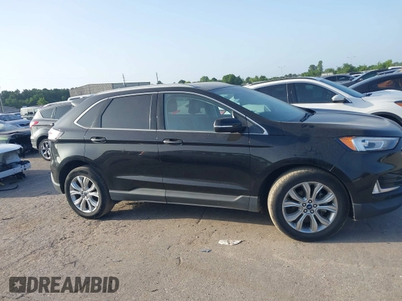 2020 Ford Edge Titanium with VIN 2FMPK3K94LBB37706, listed as a IAAI auction lot 42524373 with 77,849 mi miles and . Bid and sale history available at DreamBid. Image 13.