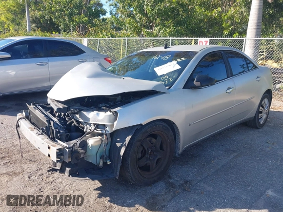 2009 Pontiac G6 w/1SA *Ltd Avail* with VIN 1G2ZG57B594156522, listed as a IAAI auction lot 40931964 with 197,196 mi miles. Bid and sale history available at carsss.com. Image 2.