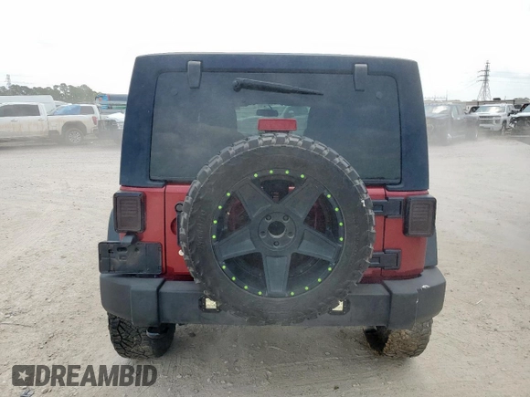 2013 Jeep Wrangler Unlimited Sport z VIN 1C4BJWDGXDL606491, wystawiony jako Copart lot #56065425 z przebiegiem 168 709 mil mil oraz Szkoda całkowita • Salvage title. Historia ofert i sprzedaży dostępna na DreamBid. Obrazek 6.
