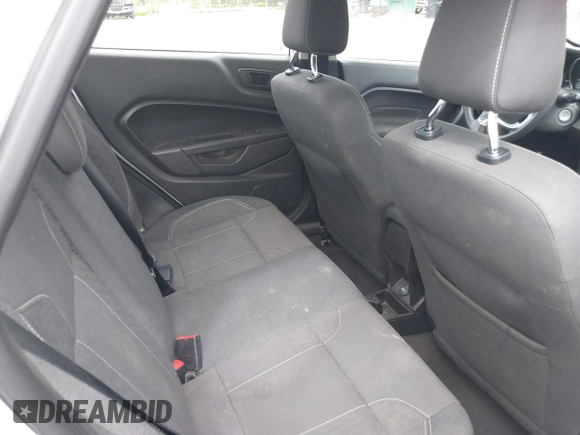 2019 Ford Fiesta SE z VIN 3FADP4BJ2KM143337, wystawiony jako IAAI lot #42179937 z przebiegiem 124 078 mil mil oraz . Historia ofert i sprzedaży dostępna na DreamBid. Obrazek 8.