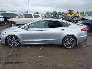 2020 Ford Fusion Titanium with VIN 3FA6P0D98LR115437, listed as a IAAI auction lot 42331052 with 127,346 mi miles and . Bid and sale history available at DreamBid. Image 14.