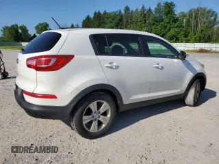 2012 Kia Sportage LX with VIN KNDPBCA21C7233424, listed as a Copart auction lot 61829465 with 129,526 mi miles and Salvage title. Bid and sale history available at DreamBid. Image 3.