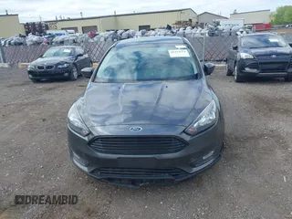 2018 Ford Focus SE z VIN 1FADP3FE5JL228583, wystawiony jako IAAI lot #42313614 z przebiegiem 84 240 mil mil oraz . Historia ofert i sprzedaży dostępna na DreamBid. Obrazek 12.