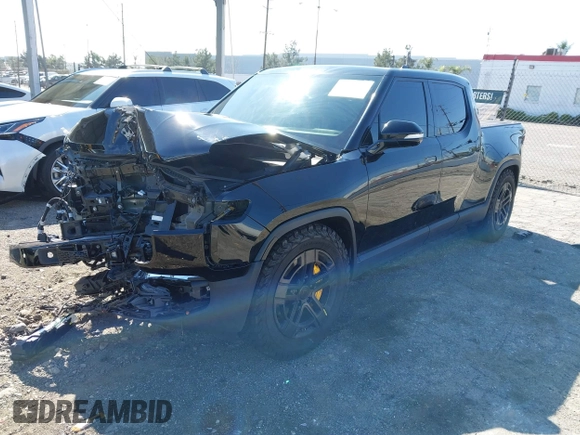 2022 Rivian R1T Launch Edition z VIN 7FCTGAAL1NN010340, wystawiony jako IAAI lot #41656762 z przebiegiem Nie podano mil oraz . Historia ofert i sprzedaży dostępna na DreamBid. Obrazek 18.