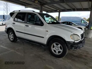 1999 Mercedes-Benz M 320/430/500 with VIN 4JGAB54E9XA130876, listed as a Copart auction lot 51714835 with 191,810 mi miles and Salvage Title. Bid and sale history available at DreamBid. Image 4.