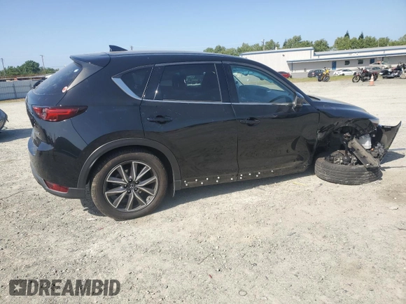 2018 Mazda CX-5 Grand Touring z VIN JM3KFBDM0J0399985, wystawiony jako Copart lot #54097665 z przebiegiem 45 344 mil mil oraz Szkoda całkowita • Salvage title. Historia ofert i sprzedaży dostępna na DreamBid. Obrazek 3.