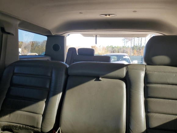 2003 Hummer H2 with VIN 5GRGN23U23H138301, listed as a Copart auction lot 77449044 with 172,174 mi miles and Salvage Title. Bid and sale history available at carsss.com. Image 10.
