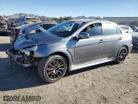 2015 Mitsubishi Lancer Evolution Final Edition z VIN JA32W7FV0FU027962, wystawiony jako Copart lot #85763774 z przebiegiem 56 671 mil mil oraz Szkoda całkowita • Salvage title. Historia ofert i sprzedaży dostępna na DreamBid. Obrazek 1.