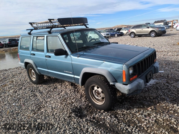 1999 Jeep Cherokee SE with VIN 1J4FF28S5XL646812, listed as a Copart auction lot 87951115 with 230,161 mi miles and Clean title. Bid and sale history available at DreamBid. Image 4.
