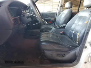 1996 Jeep Grand Cherokee with VIN 1J4EZ78Y9TC104398, listed as a Copart auction lot 69706254 with Not provided miles and Salvage title. Bid and sale history available at DreamBid. Image 7.