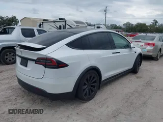 2022 Tesla Model X with VIN 7SAXCBE56NF364067, listed as a IAAI auction lot 40947378 with Not Provided miles and . Bid and sale history available at DreamBid. Image 4.