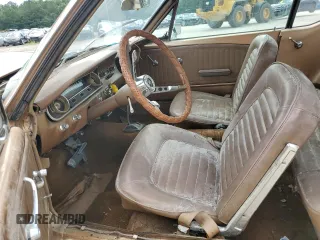 1965 Ford Mustang z VIN 5F07D184129, wystawiony jako Copart lot #66800994 z przebiegiem 85 909 mil mil oraz Szkody całkowita. Historia ofert i sprzedaży dostępna na DreamBid. Obrazek 7.