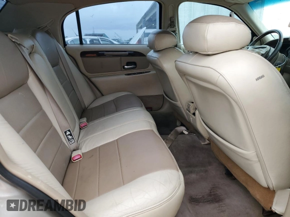 2000 Lincoln Town Car Signature с VIN 1LNHM82W1YY903645, выставлен на аукционе Copart как лот 55663175 с пробегом Не указан миль и Списание • Salvage title. История ставок и продаж доступна на DreamBid. Изображение 10.