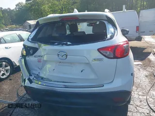 2014 Mazda CX-5 Grand Touring with VIN JM3KE2DY1E0424890, listed as a IAAI auction lot 42052437 with 107,793 mi miles. Bid and sale history available at carsss.com. Image 16.