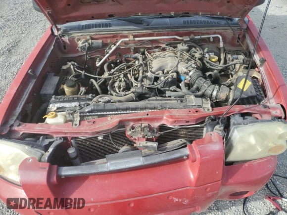 2003 Nissan Frontier XE with VIN 1N6ED27T73C420215, listed as a Copart auction lot 82923734 with 193,468 mi miles and Salvage title. Bid and sale history available at DreamBid. Image 12.