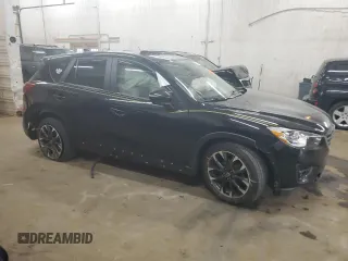 2016 Mazda CX-5 Grand Touring with VIN JM3KE4DY0G0854568, listed as a Copart auction lot 53259345 with 74,264 mi miles and Salvage Title. Bid and sale history available at carsss.com. Image 4.