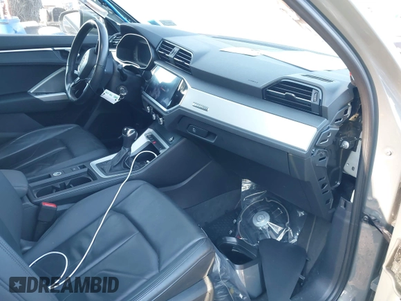 2021 Audi Q3 Premium with VIN WA1AUCF34M1099668, listed as a IAAI auction lot 41990226 with 69,866 mi miles and . Bid and sale history available at DreamBid. Image 5.