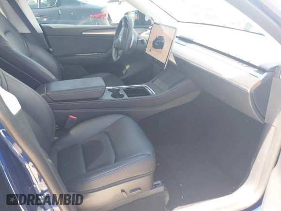 2023 Tesla Model Y Performance with VIN 7SAYGDEF9PF582908, listed as a IAAI auction lot 41930957 with 52,857 mi miles and . Bid and sale history available at DreamBid. Image 5.