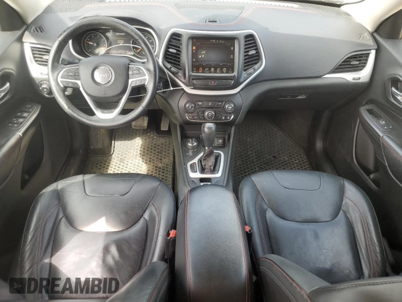 2015 Jeep Cherokee Trailhawk with VIN 1C4PJMBB1FW630715, listed as a Copart auction lot 58559675 with 58,302 mi miles and Salvage title. Bid and sale history available at DreamBid. Image 8.