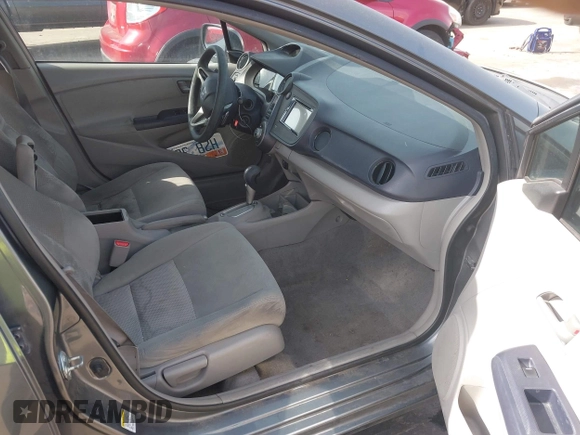 2010 Honda Insight EX with VIN JHMZE2H71AS032532, listed as a IAAI auction lot 41988221 with 333,144 mi miles and . Bid and sale history available at DreamBid. Image 5.