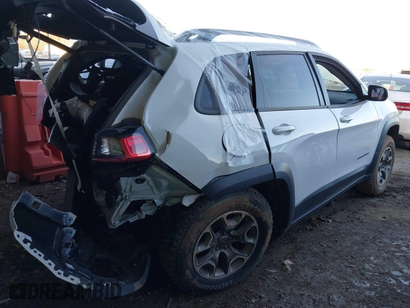 2021 Jeep Cherokee Trailhawk with VIN 1C4PJMBX4MD153086, listed as a IAAI auction lot 41132030 with 56,367 mi miles and . Bid and sale history available at DreamBid. Image 4.