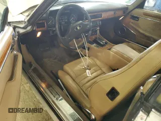 1989 Jaguar XJS z VIN SAJNV4847KC151989, wystawiony jako Copart lot #61401054 z przebiegiem 80 570 mil mil oraz Szkody całkowita. Historia ofert i sprzedaży dostępna na DreamBid. Obrazek 8.